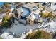 Birds-eye-view of home showing multiple roof lines, deck, patio, backyard, professional landscaping and mature trees at 1803 Avenida Del Sol, Castle Rock, CO 80104