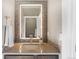 This bathroom features a mosaic tile mirror and modern fixtures that add a touch of elegance at 1803 Avenida Del Sol, Castle Rock, CO 80104