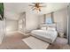 Bright bedroom with a bed, a ceiling fan, and large windows providing ample natural light at 1803 Avenida Del Sol, Castle Rock, CO 80104