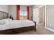 Comfortable bedroom with a large window, plush carpeting, and a neutral color palette at 1803 Avenida Del Sol, Castle Rock, CO 80104