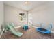 Playroom with ample space for activities, window views, and includes a toddler trampoline and slide at 1803 Avenida Del Sol, Castle Rock, CO 80104