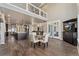 Open concept living and dining area with views of the kitchen and upper level at 1803 Avenida Del Sol, Castle Rock, CO 80104