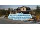 Inviting home exterior showcasing a stone facade, balcony, three-car garage, and meticulous landscaping at 1803 Avenida Del Sol, Castle Rock, CO 80104