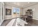 Bright home office featuring French doors, built-in shelving, and a unique desk at 1803 Avenida Del Sol, Castle Rock, CO 80104