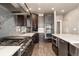 Modern kitchen showcasing stainless steel appliances, gas range, and custom cabinetry at 1803 Avenida Del Sol, Castle Rock, CO 80104
