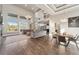 Spacious living area showcasing tall windows, hardwood flooring, and stylish decor for modern comfort at 1803 Avenida Del Sol, Castle Rock, CO 80104