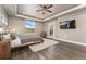 Serene main bedroom with tray ceiling, private balcony, and cozy sitting area at 1803 Avenida Del Sol, Castle Rock, CO 80104