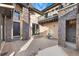 Outdoor patio featuring stone columns, ambient lighting, and a tranquil fountain, perfect for relaxing and entertaining at 1803 Avenida Del Sol, Castle Rock, CO 80104