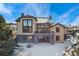 Two-story house with a patio deck and beautiful stone siding at 1803 Avenida Del Sol, Castle Rock, CO 80104