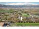 Scenic aerial view of the property near green spaces with mountain views in the background at 1542 Kilkenny St, Boulder, CO 80303
