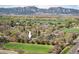 Aerial view showing property's proximity to green spaces and the surrounding neighborhood with mountain views at 1542 Kilkenny St, Boulder, CO 80303