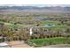 Aerial view shows property location near athletic fields, green spaces, and the surrounding neighborhood with mountain views at 1542 Kilkenny St, Boulder, CO 80303