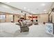 Spacious finished basement with seating area, workout space, and open access to a kitchenette at 5683 Fig Way, Arvada, CO 80002