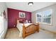 Cozy bedroom with natural light, comfortable furnishings, and soothing color scheme at 5683 Fig Way, Arvada, CO 80002