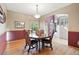 Cozy dining room with a round table and upholstered chairs, perfect for intimate gatherings at 5683 Fig Way, Arvada, CO 80002