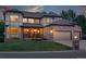Charming brick and stucco two-story home with a well-manicured lawn and attached two car garage at 5683 Fig Way, Arvada, CO 80002