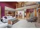 Spacious living room with a fireplace, high ceilings, and an open floor plan that connects to the kitchen at 5683 Fig Way, Arvada, CO 80002