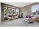 Sun-filled living room with a bay window, neutral colors, and comfortable seating at 5683 Fig Way, Arvada, CO 80002