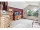 Bright, spacious main bedroom with vaulted ceiling, ensuite bath, and light colored carpet at 5683 Fig Way, Arvada, CO 80002