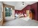 Spacious main bedroom featuring ensuite bath, vaulted ceiling, and bright natural light at 5683 Fig Way, Arvada, CO 80002