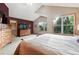 Bright, spacious main bedroom with ensuite bath, vaulted ceiling, and large windows at 5683 Fig Way, Arvada, CO 80002
