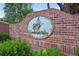 Elegant brick entrance with a decorative Candlelight Valley neighborhood sign at 5683 Fig Way, Arvada, CO 80002