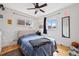 Bright bedroom with natural light, hardwood floors, and comfortable furnishings at 1530 W Berkeley Pl, Denver, CO 80221