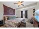 Comfortable bedroom featuring a queen-size bed, ceiling fan, and cozy decor at 1530 W Berkeley Pl, Denver, CO 80221