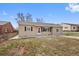 Charming single-story home boasts a well-maintained lawn and inviting front entrance at 1530 W Berkeley Pl, Denver, CO 80221