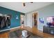 Spacious living room showcasing hardwood floors and an open layout with access to other rooms at 1530 W Berkeley Pl, Denver, CO 80221
