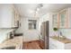 Updated kitchen featuring stainless steel appliances, granite countertops, and modern cabinetry at 1370 Upham St, Lakewood, CO 80214