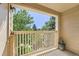 Private balcony with white railing overlooking a courtyard at 9963 E Carolina Cir # 202, Aurora, CO 80247