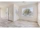 Bright entryway with white door and wood-look tile floor at 9963 E Carolina Cir # 202, Aurora, CO 80247