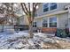 Backyard with grill, fence, and tree in winter setting at 13068 Harrison Dr, Thornton, CO 80241