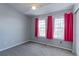 Bright bedroom features neutral walls, carpeted floors, and a large window at 13068 Harrison Dr, Thornton, CO 80241