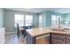 Eat-in kitchen area with a dining table and chairs, adjacent to the kitchen at 13068 Harrison Dr, Thornton, CO 80241