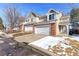 Attractive townhome featuring a two-car garage and brick detailing in a lovely neighborhood at 13068 Harrison Dr, Thornton, CO 80241