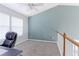 Bright loft space with large window, vaulted ceiling, and neutral carpeting at 13068 Harrison Dr, Thornton, CO 80241