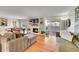 Inviting living room with fireplace, hardwood floors, and sliding door to balcony at 2005 Tabor Dr, Lakewood, CO 80215