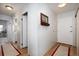 Hallway with wood floors leads to bedrooms, bathroom, and closet at 3082 S Wheeling Way # 410, Aurora, CO 80014