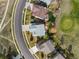 Aerial view of a house showing a well-maintained yard, patio, and golf course at 1936 Alpine Dr, Erie, CO 80516