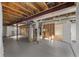 Unfinished basement with exposed beams, ductwork, and utilities on a painted concrete floor at 1936 Alpine Dr, Erie, CO 80516