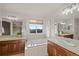 This bathroom has double sinks, a soaking tub under a window, and stylish fixtures at 1936 Alpine Dr, Erie, CO 80516