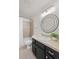 Bathroom featuring a vanity with a sink, an accent mirror, and a shower over the tub at 1936 Alpine Dr, Erie, CO 80516