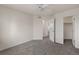 Carpeted bedroom with an open door to the hallway and a closet at 1936 Alpine Dr, Erie, CO 80516