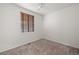 Bedroom with neutral carpet, a ceiling fan, and a window for natural light at 1936 Alpine Dr, Erie, CO 80516