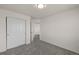 Bedroom with plush gray carpet, a closet with doors, and neutral wall paint at 1936 Alpine Dr, Erie, CO 80516