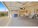 Clean, well-lit three-car garage with plenty of space for storage and work area at 1936 Alpine Dr, Erie, CO 80516