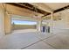Spacious three-car garage with high ceilings, offering ample parking and storage at 1936 Alpine Dr, Erie, CO 80516