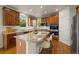 A beautiful kitchen with stainless steel appliances, granite countertops, and hardwood floors at 1936 Alpine Dr, Erie, CO 80516